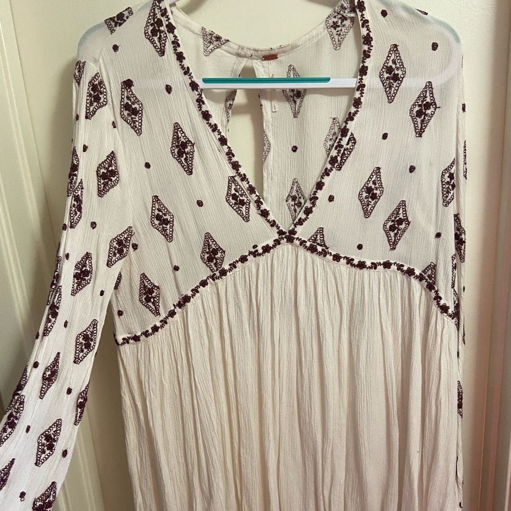 Long white shirts with smaller bell sleeves